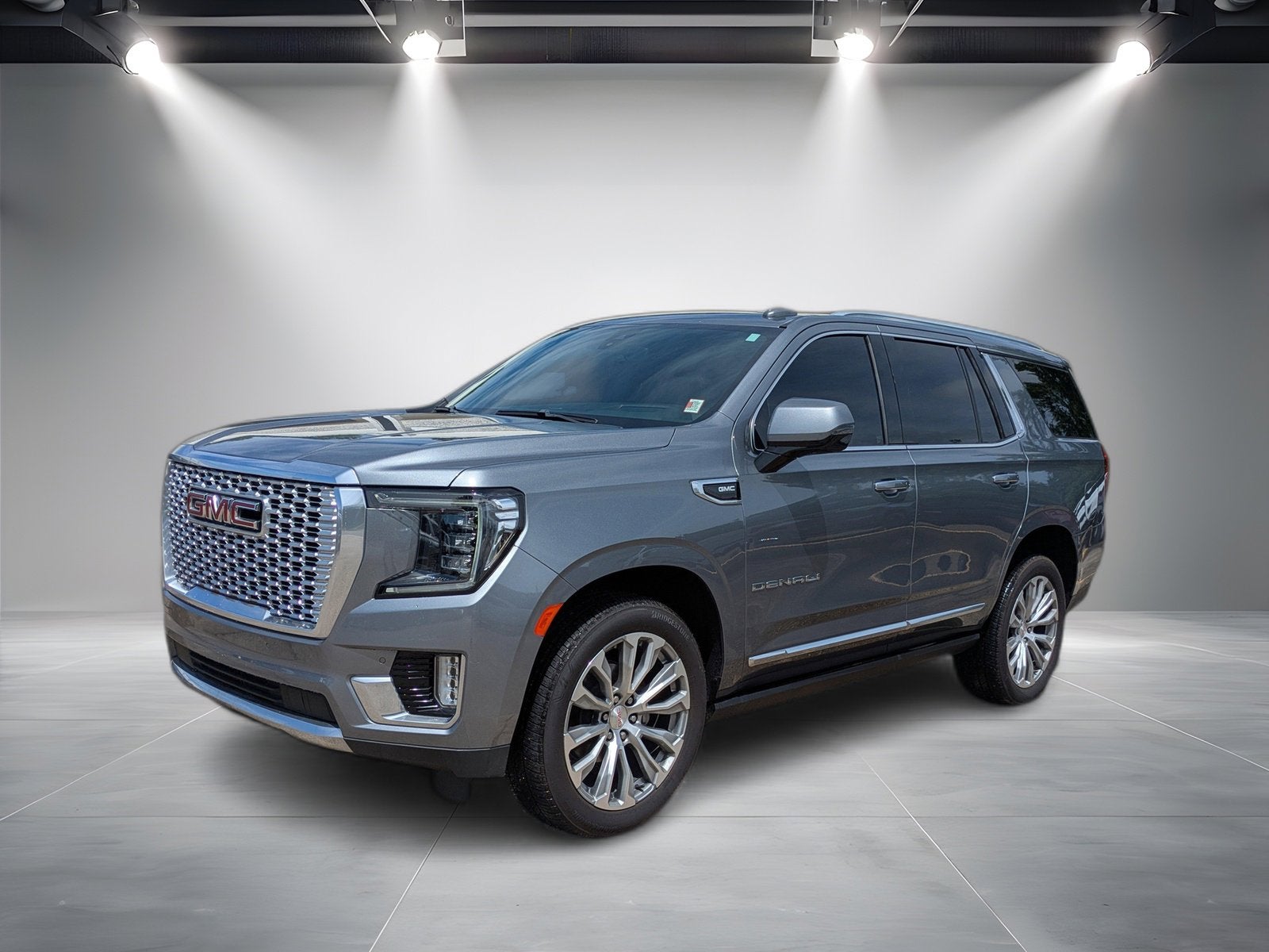 2022 GMC Yukon Denali in Satin Steel Metallic — front three-quarter view